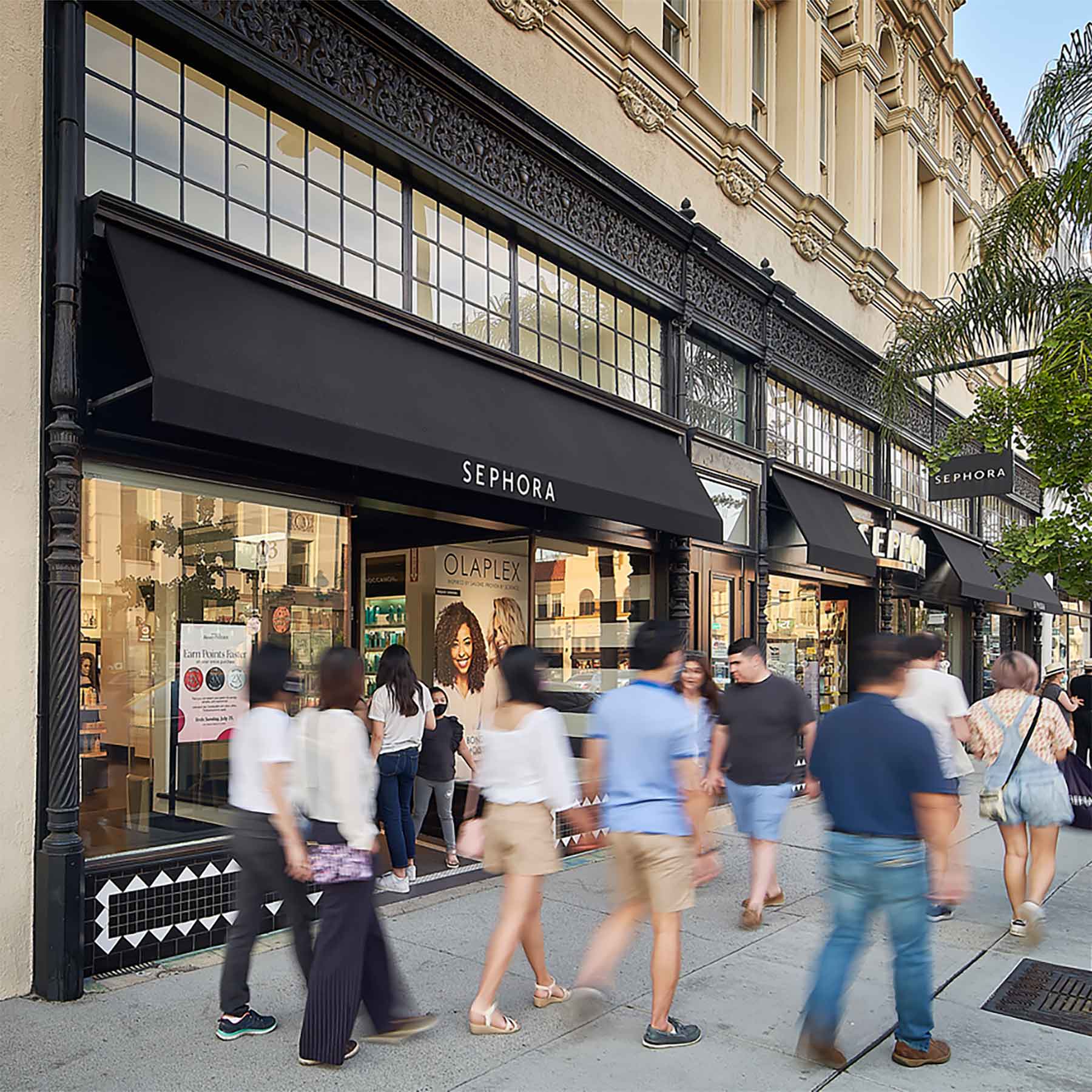 People walking in front of Sephora