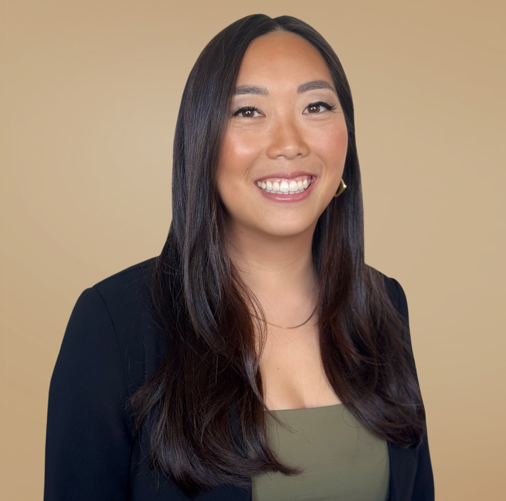 Ayrika Ng smiling in business attire