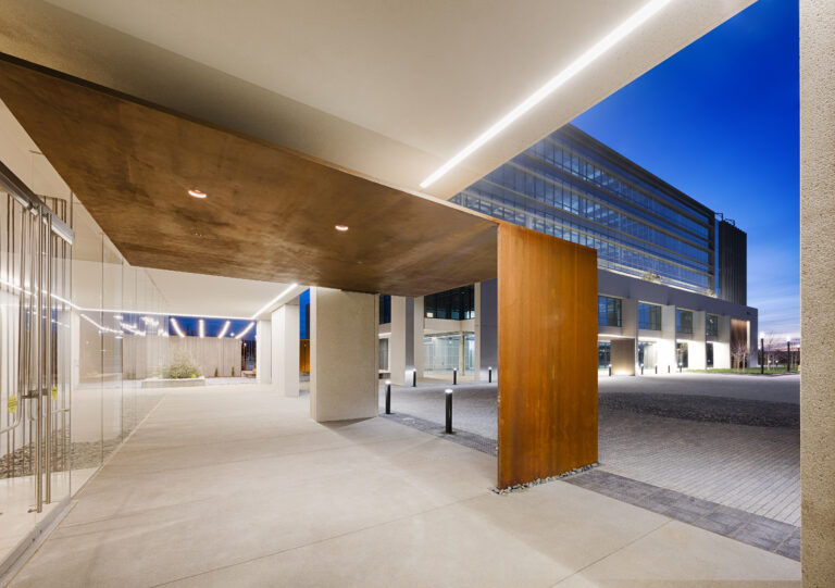 Modern building entrance at dusk.
