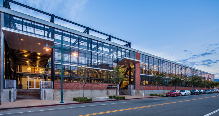 Modern glass building with brick facade