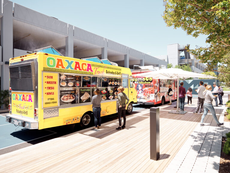 Colorful food trucks in outdoor setting.