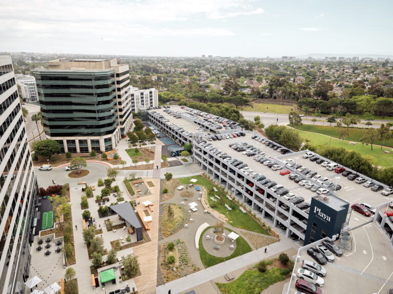 Urban landscape with parking and greenery