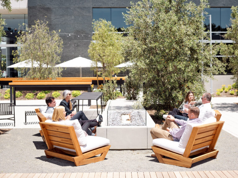 People relaxing in outdoor seating area.