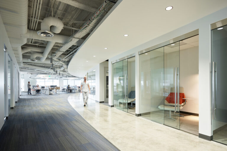 Modern office space with glass meeting rooms.